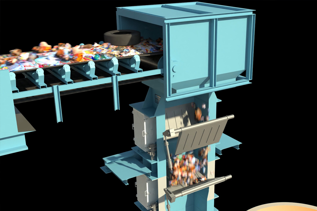 Waste fuel on a feed conveyor, dropping into a multistage gate