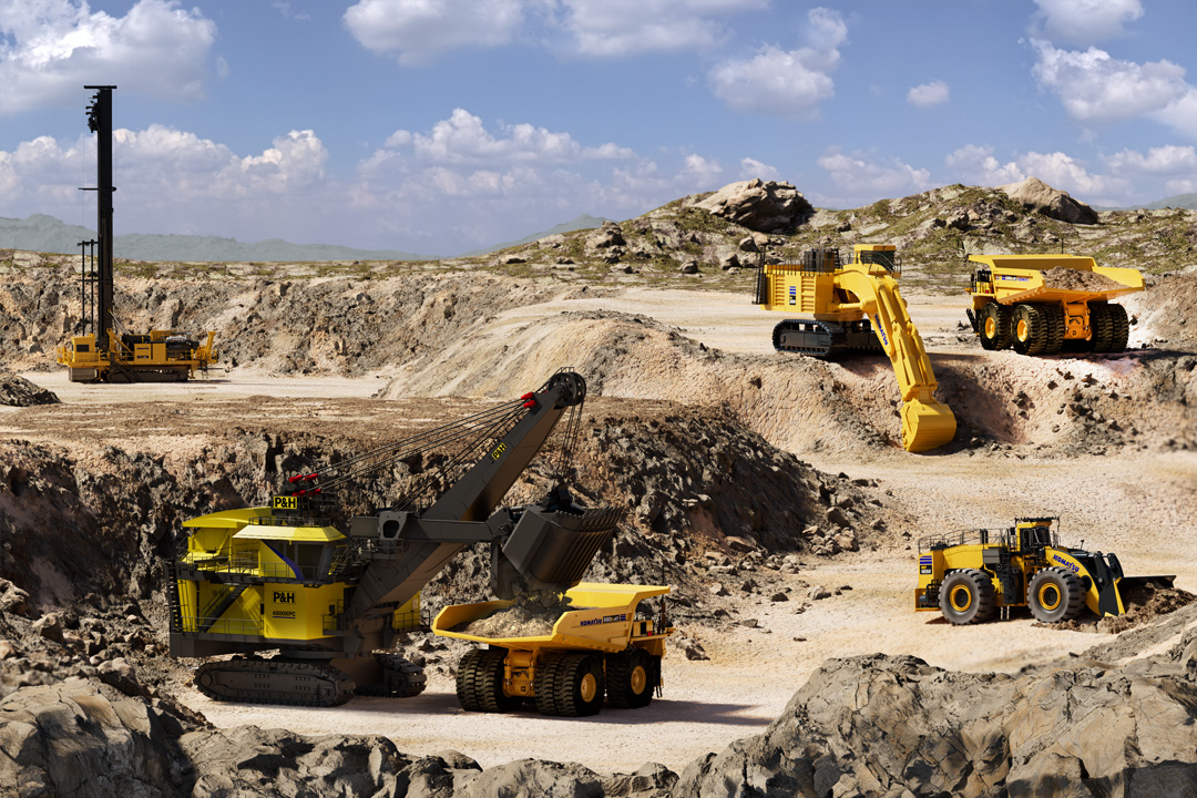 Large open-pit mining site with heavy mining machines, including a rope shovel, hydraulic shovel,  blasting rig, and haul trucks