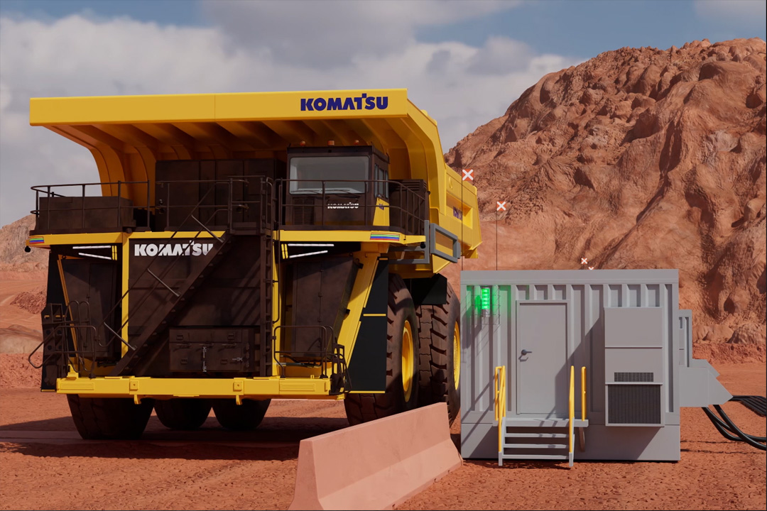 Electric mining haul truck recharging at a charging station 